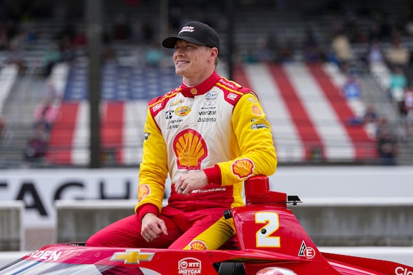 Josef Newgarden poses for a photo after he qualified for the Indianapolis 500 auto race at Indianapolis Motor Speedway in Indianapolis, Saturday, May 17, 2025. (AP Photo/Michael Conroy)