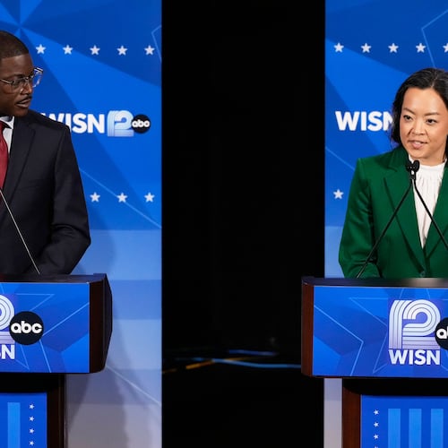 Democratic gubernatorial candidate Francesca Hong, right, talks as David Crowley listens during a primary debate in Milwaukee, Tuesday, July 28, 2026. (AP Photo/Nam Y. Huh)