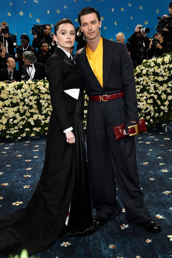 Aimee Lou Wood, left, Patrick Schwarzenegger attend The Metropolitan Museum of Art's Costume Institute benefit gala celebrating the opening of the "Superfine: Tailoring Black Style" exhibition on Monday, May 5, 2025, in New York. (Photo by Evan Agostini/Invision/AP)