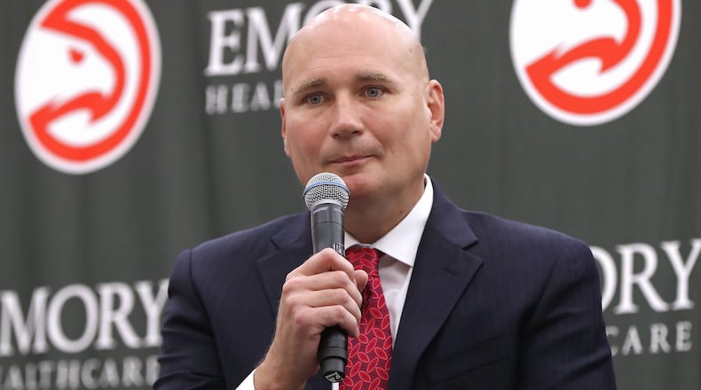 The Atlanta Hawks general manager Travis Schlenk introduces Lloyd Pierce as the 13th full-time coach in the Atlanta history of the NBA basketball franchise on Monday, May 14, 2018, in Atlanta. Curtis Compton/ccompton@ajc.com