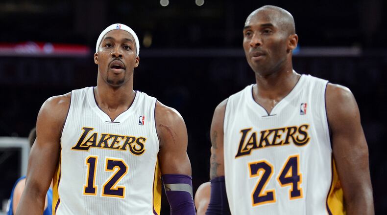 Dwight Howard (left) and Kobe Bryant of the Los Angeles Lakers leave the court during a game in 2012. (Photo by Harry How/Getty Images)