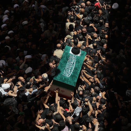 The coffin of the late Iranian Supreme Leader Ayatollah Ali Khamenei is carried by mourners to the Imam Ali Shrine in Najaf, Iraq, Wednesday, July 8, 2026. (AP Photo/Anmar Khalil)