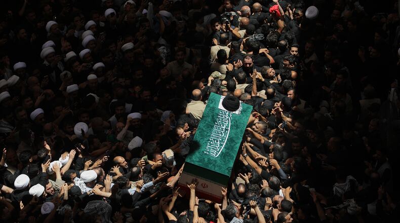 The coffin of the late Iranian Supreme Leader Ayatollah Ali Khamenei is carried by mourners to the Imam Ali Shrine in Najaf, Iraq, Wednesday, July 8, 2026. (AP Photo/Anmar Khalil)