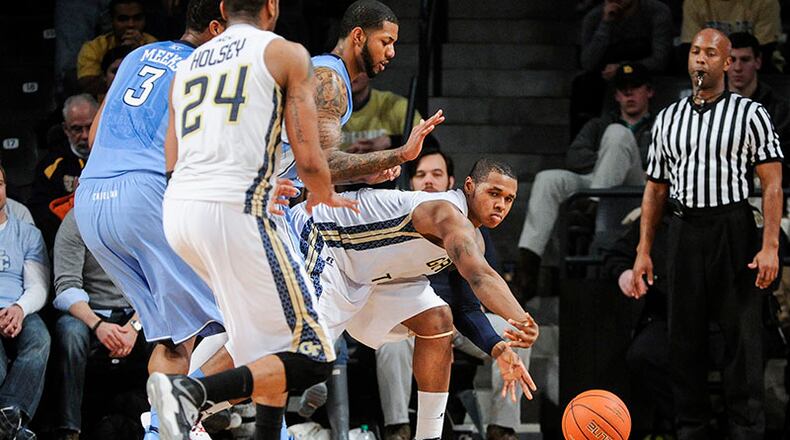 Georgia Tech forward Marcus Georges-Hunt (3) gets a pass off to forward Kammeon Holsey (24) as North Carolina defends during an NCAA college basketball game, Wednesday, Jan. 29, 2014, in Atlanta. North Carolina won 78-65. (AP Photo/John Amis) As Atlanta recovered from a snowstorm that wreaked havoc across the region, North Carolina thrashed Georgia Tech 78-65 at McCammish Pavilion in Atlanta. (John Amis / AP)
