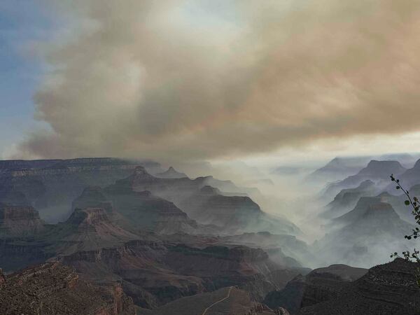This photo provided by Caren Carney shows the family's view of fires over the Grand Canyon after they had to evacuate Grand Canyon Lodge, a historic lodge on the North Rim, in northern Arizona, Thursday, July 10, 2025. (Caren Carney via AP)