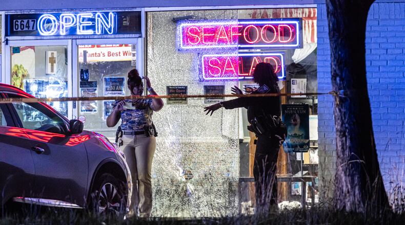 DeKalb police responded around 2 a.m. to Atlanta’s Best Wings in the 6600 block of Covington Highway, where officers found two people suffering from gunshot wounds in critical condition after authorities said they shot each other at a chicken wing restaurant in DeKalb County early Wednesday, June 5, 2024. (John Spink/AJC)