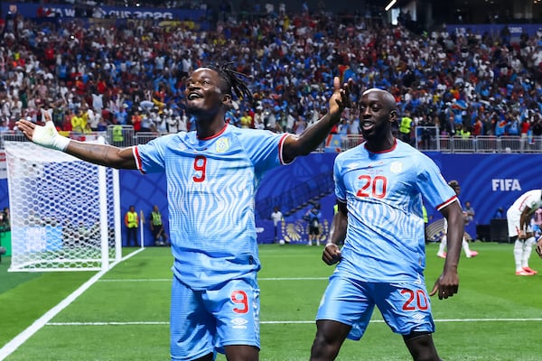 Congo forward Brian Cipenga (left) celebrates with teammate Yoane Wissa (right) after scoring a goal against England during the first half of a FIFA World Cup round of 32 match at Atlanta Stadium (Mercedes-Benz Stadium) on Wednesday, July 1, 2026, in Atlanta. (Jason Getz/AJC)