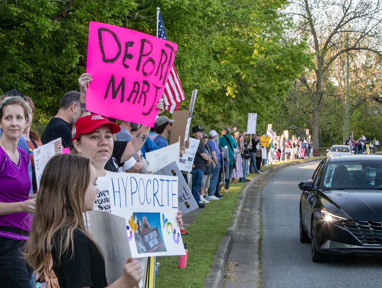 Majorie Taylor Greene holds a town hall at the Acworth Community Center on Tuesday, April 15, 2025. Protestors lined the street outside and disrupted the meeting multiple times.  (Jenni Girtman for The Atlanta Journal-Constitution)