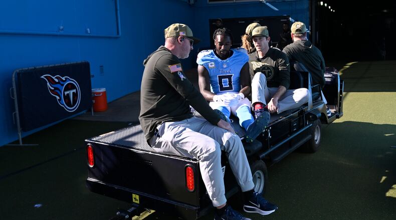 Tennessee Titans wide receiver Calvin Ridley is taken off the field after being injured during the first half of an NFL football game against the Houston Texans on Sunday, Nov. 16, 2025, in Nashville, Tenn. (AP Photo/John Amis)