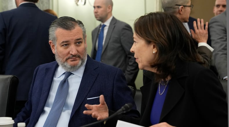 FILE - Senate Commerce, Science, and Transportation Committee Chair Sen. Ted Cruz, R-Texas, left, talks with ranking member Sen. Maria Cantwell, D-Wash., right, before the start a hearing on Capitol Hill in Washington, Wednesday, Jan. 15, 2025. (AP Photo/Susan Walsh,File)