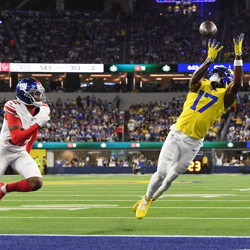 Los Angeles Rams wide receiver Davante Adams (17) makes a touchdown catch past New York Giants cornerback Colton Hood (12) during the second half of an NFL football game in Inglewood, Calif., Monday, Sept. 21, 2026. (AP Photo/Katie Chin)