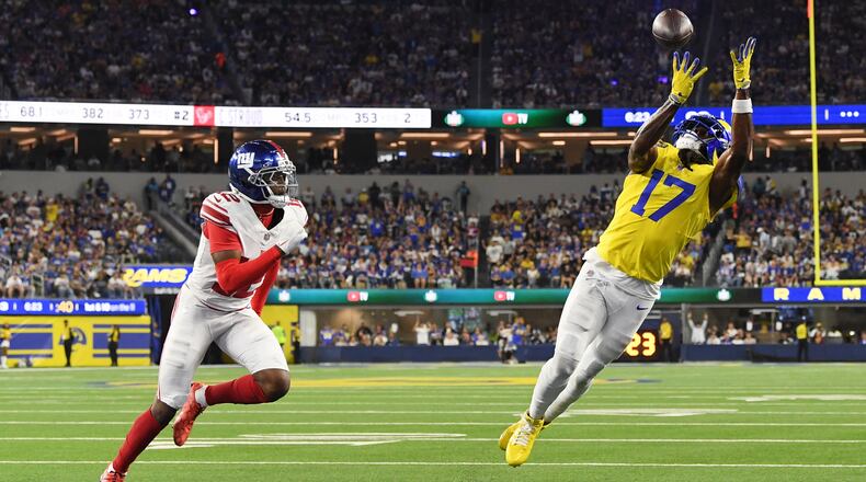 Los Angeles Rams wide receiver Davante Adams (17) makes a touchdown catch past New York Giants cornerback Colton Hood (12) during the second half of an NFL football game in Inglewood, Calif., Monday, Sept. 21, 2026. (AP Photo/Katie Chin)