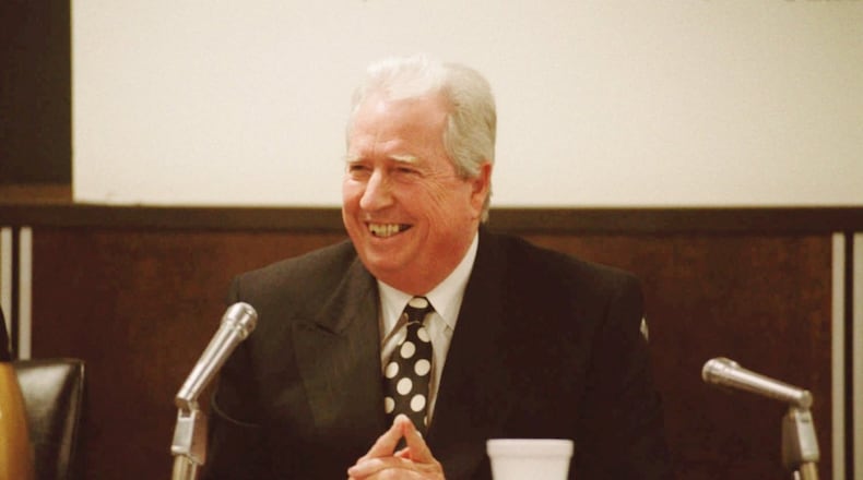 DeKalb County School Superintendent Robert Freeman laughs after making a comment after his announcement to the DeKalb school board in June 1996 that he would be resigning.