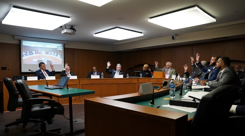 The Georgia Senate Ethics Committee votes in favor of moving forward Senate Bill 221, elections legislation, during a committee meeting in February at the Georgia Capitol in Atlanta. (Olivia Bowdoin for the AJC).