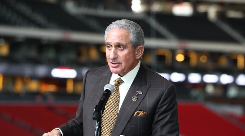 Arthur Blank is presented with a plaque for Mercedes-Benz Stadium’s LEED Platinum certification.