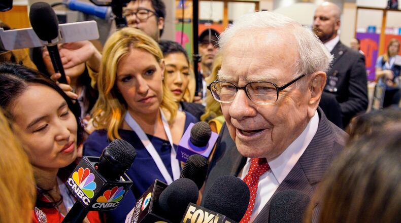 FILE - Warren Buffett, Chairman and CEO of Berkshire Hathaway, speaks to reporters before presiding over the annual shareholders meeting in Omaha, Neb., May 4, 2019. (AP Photo/Nati Harnik, File)