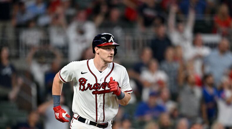 Atlanta Braves' catcher Sean Murphy (12) reaches on a fielding error by Chicago Cubs' right fielder Seiya Suzuki during the eighth inning at Truist Park, Tuesday, September 26, 2023, in Atlanta. (Hyosub Shin / Hyosub.Shin@ajc.com)