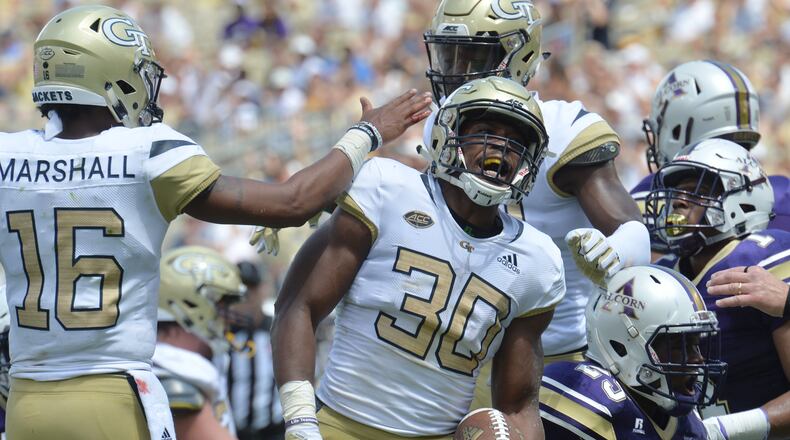 September 1, 2018 Atlanta - Georgia Tech running back KirVonte Benson (30) celebrates with teammates after he scored a touchdown in the first half of the Georgia Tech home opener at Bobby Dodd Stadium on Saturday, September 1, 2018. HYOSUB SHIN / HSHIN@AJC.COM