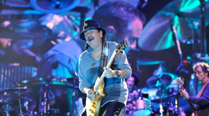 Carlos Santana performs at the Many Rivers To Cross Music and Arts Festival in Fairburn, Georgia on Saturday, October 1, 2016. (DAVID BARNES / DAVID.BARNES@AJC.COM)