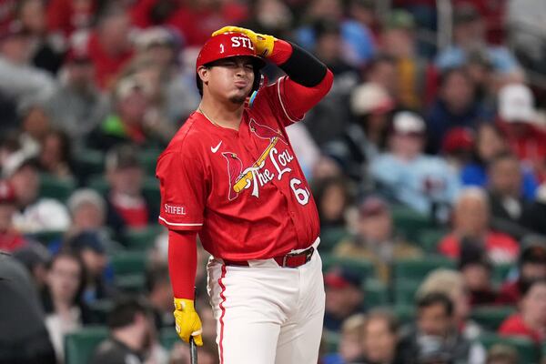 St. Louis Cardinals' Yohel Pozo reacts after taking a strike during the second inning of a baseball game against the Philadelphia Phillies Friday, April 11, 2025, in St. Louis. (AP Photo/Jeff Roberson)