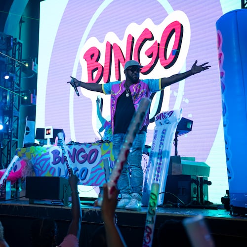 The emcee warms up the crowd from the stage during Bingo Loco at Believe Music Hall in Atlanta on Saturday, July 18, 2026. (Olivia Bowdoin for the AJC)
