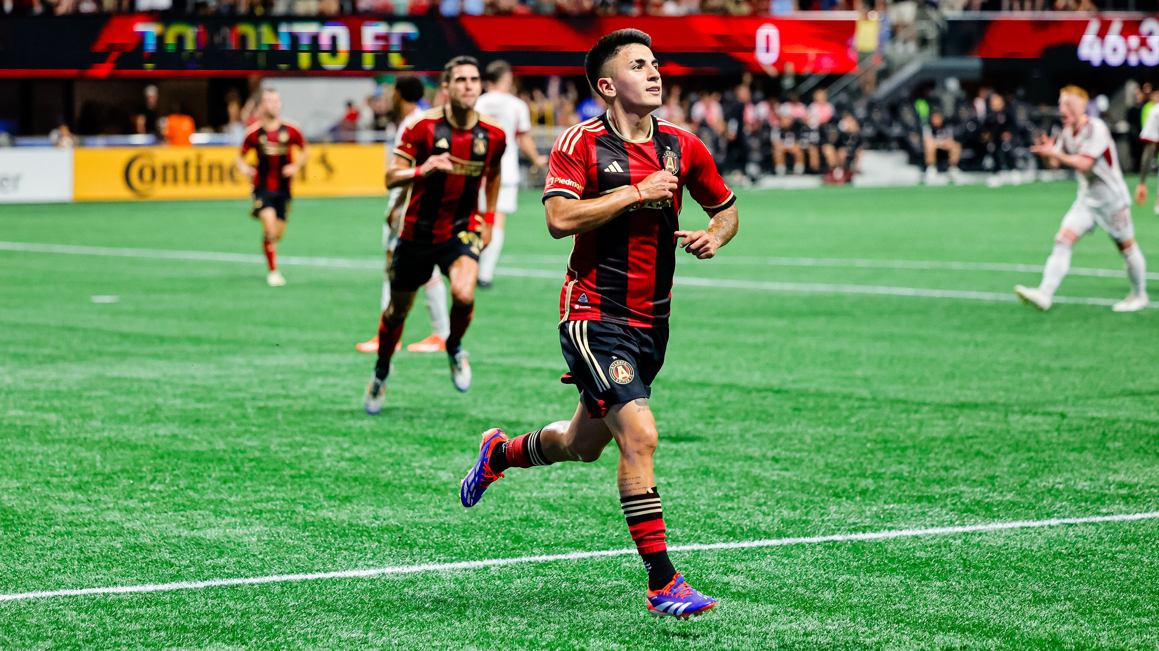 Atlanta United midfielder Thiago Almada (center) celebrates after scoring a goal during the match against the Toronto FC at Mercedes-Benz Stadium in Atlanta. (Photo by Alex Slitz/AJC 2024)
