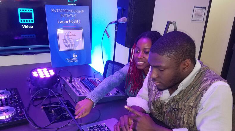 Georgia State University students Jeanine McDonald (left), Jordan Adeboye (right) work in the new LaunchGSU lab. Photo Credit: Erica Bracey, Georgia State University.