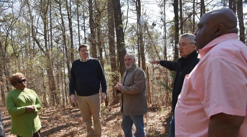 (From left) Bobbie Hart, Wesley Edwards, Michael Bowen, Gene Bowen and Mike Merideth visit the Troup County site where Austin Callaway was found bleeding to death from gunshot wounds in 1940. Their organization, Troup Together, has been researching Callaway’s lynching and working to promote racial dialogue in the county. HYOSUB SHIN / HSHIN@AJC.COM