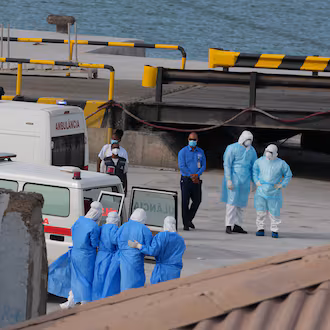 Health workers in protective gear evacuate patients from the MV Hondius cruise ship at a port in Praia, Cape Verde, Wednesday, May 6, 2026. (Misper Apawu/AP)