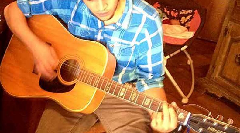 Quentin Muse, 20, taught himself how to play guitar, his co-worker and friend said. (Special photo)