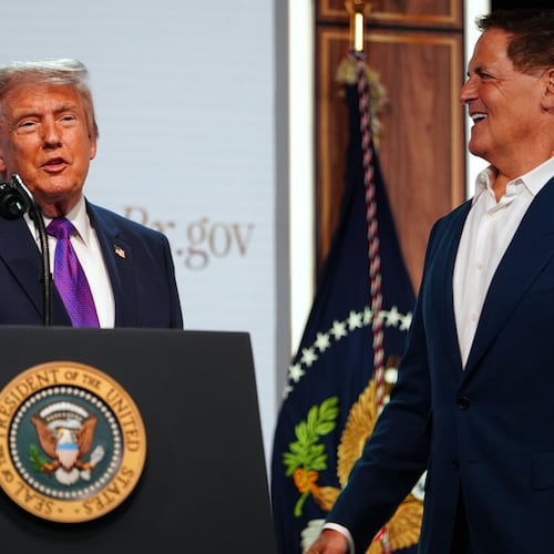 President Donald Trump shakes hands with Mark Cuban of Cost Plus Drugs, as he speaks about prescription drug prices in the South Court Auditorium in the Eisenhower Executive Office Building on the White House campus, Monday, May 18, 2026, in Washington. (AP Photo/Julia Demaree Nikhinson)