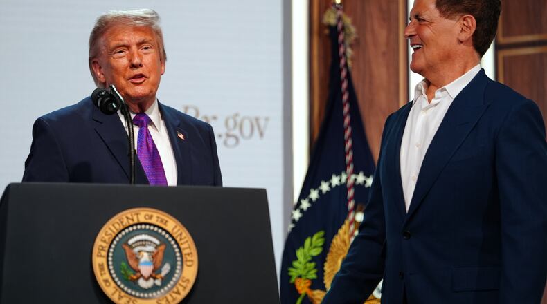 President Donald Trump shakes hands with Mark Cuban of Cost Plus Drugs, as he speaks about prescription drug prices in the South Court Auditorium in the Eisenhower Executive Office Building on the White House campus, Monday, May 18, 2026, in Washington. (AP Photo/Julia Demaree Nikhinson)
