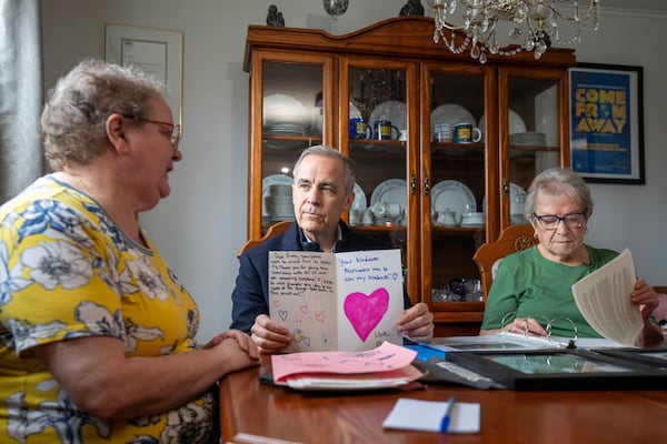 Canada Prime Minister Mark Carney meets with Beulah Cooper and Diane Davis, left, in Gander, N.L., on Monday March 24, 2025. (Frank Gunn/The Canadian Press via AP)