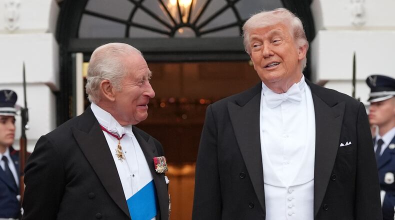 President Donald Trump greets Britain's King Charles III at the South Portico of the White House for a State Dinner Tuesday, April 28, 2026, in Washington. (AP Photo/Alex Brandon)
