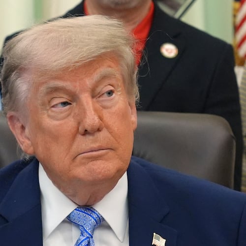 President Donald Trump attends an event about loosening a federal refrigerant rule, in the Oval Office at the White House, Thursday, May 21, 2026, in Washington. (AP Photo/Jacquelyn Martin)
