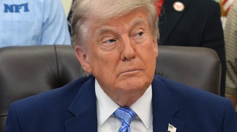 President Donald Trump attends an event about loosening a federal refrigerant rule, in the Oval Office at the White House, Thursday, May 21, 2026, in Washington. (AP Photo/Jacquelyn Martin)