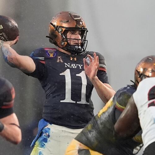 Navy quarterback Blake Horvath (11) looks to throw a pass during the first half of the Liberty Bowl NCAA college football game against Cincinnati, Friday, Jan. 2, 2026, in Memphis, Tenn. (AP Photo/George Walker IV)