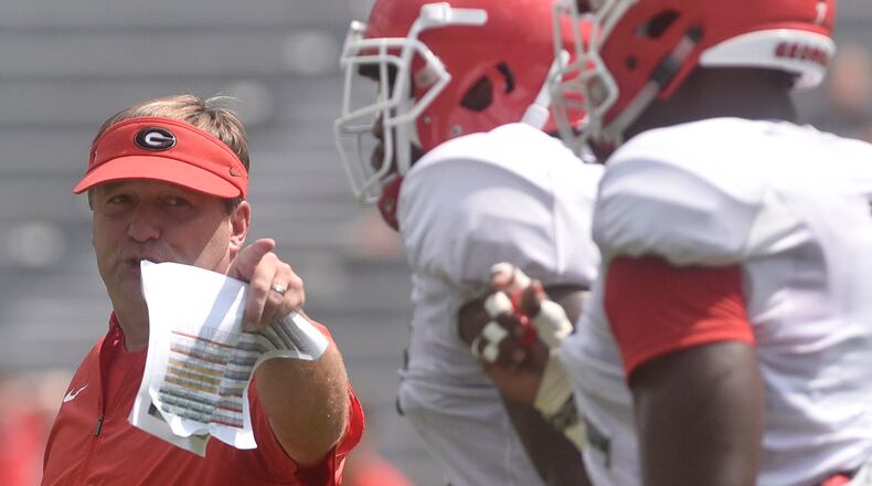 Georgia Kirby Smart talks to a group of Bulldogs during the annual UGA Fan Day at Sanford Stadium Saturday, Aug. 5, 2017, in Athens.