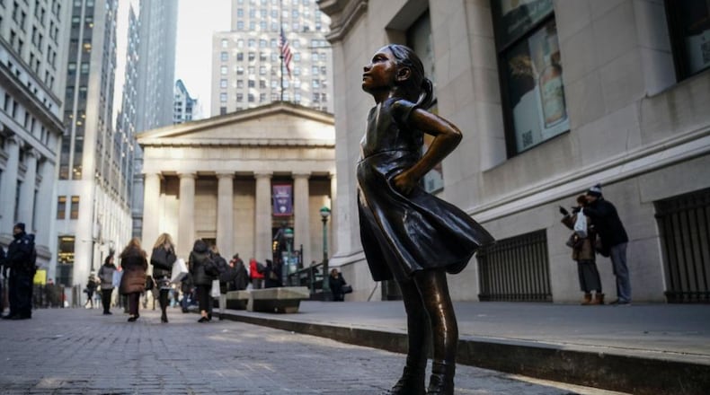 The Fearless Girl statue moved to its new home Monday, across from the New York Stock Exchange.
