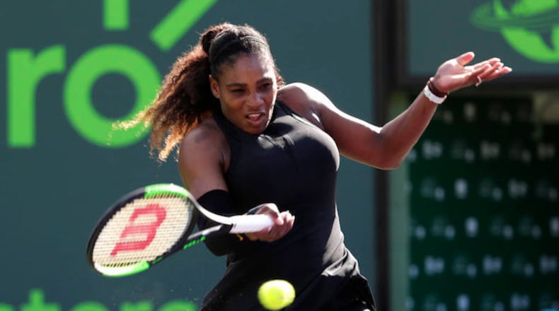 Serena Williams returns to Naomi Osaka of Japan, during the Miami Open tennis tournament, Wednesday, March 21, 2018, in Key Biscayne, Fla. (AP Photo/Lynne Sladky)