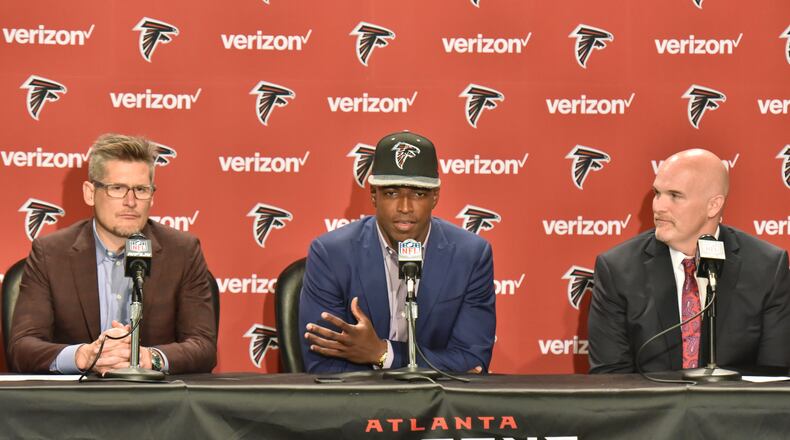 April 29, 2016 Flowery Branch - Falcons first-round pick Keanu Neal speaks as Falcons general manager Thomas Dimitroff (left) and coach Dan Quinn sit next him during a press conference at the Falcons' Flowery Branch Headquarters Complex on Friday, April 29, 2016. With the 17th pick in the 2016 NFL Draft, the Falcons selected defensive back Keanu Neal of Florida. HYOSUB SHIN / HSHIN@AJC.COM