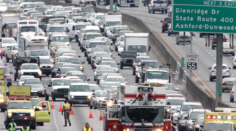 A traffic accident shuts down I-285 in Sandy Springs. The city has introduced three ways to keep commuters posted of emergency road closures. JOHN SPINK / JSPINK@AJC.COM
