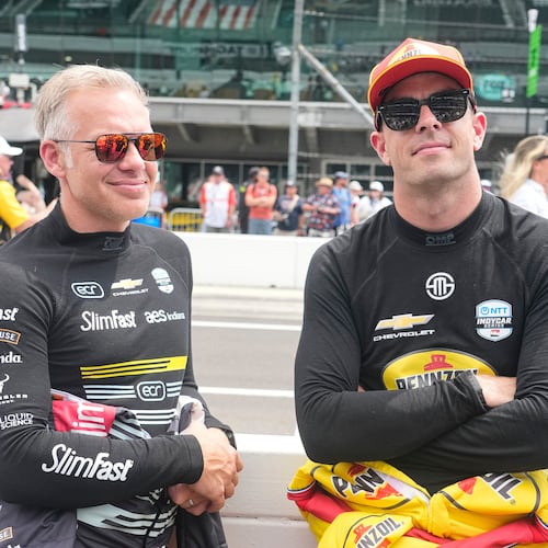 Ed Carpenter, left, talks with Scott McLaughlin before practice for the Indianapolis 500 auto race at the Indianapolis Motor Speedway in Indianapolis, Monday, May 18, 2026. (AP Photo/Michael Conroy)