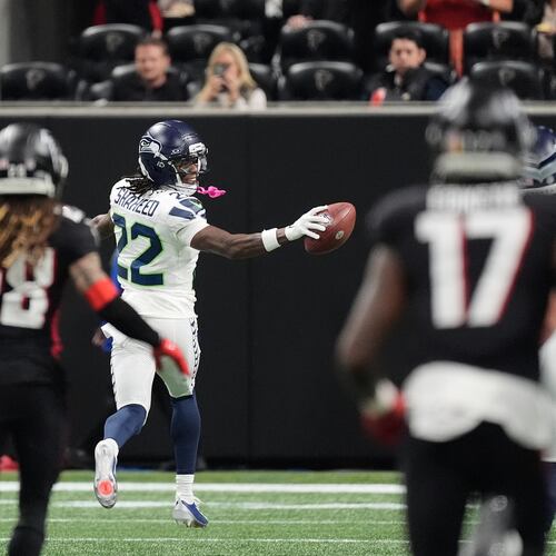 Seattle Seahawks wide receiver Rashid Shaheed (22) looks back as he runs for a touchdown on a kickoff return against the Atlanta Falcons during the second half of an NFL football game, Sunday, Dec. 7, 2025, in Atlanta. (AP Photo/Mike Stewart)