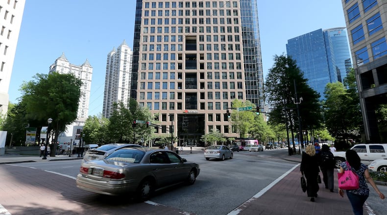 Developer John Dewberry thinks a six-story addition would make the Campanile building (center) "tall and slender" instead of "short and fat."
