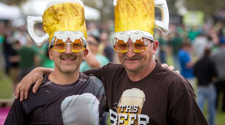 Justin Lester (L) and Scott George show of there beer fest hats at the Suwanee Beer Fest in Suwanee. STEVE SCHAEFER / SPECIAL TO THE AJC