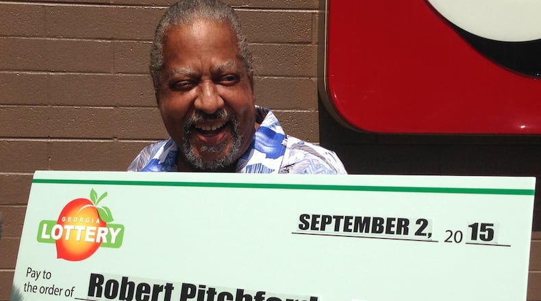 Robert Pitchford poses with his ceremonial big check. (Georgia Lottery Corp.)