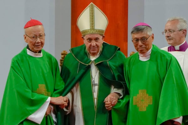 FILE - Pope Francis is joined by Cardinal John Tong Hon, left, and Cardinal-elect Stephen Chow, both from Hong Kong, after presiding over a mass at the Steppe Arena in the Mongolian capital Ulaanbaatar, Sunday, Sept. 3, 2023. (AP Photo/Ng Han Guan, File)