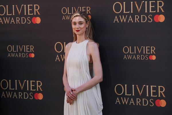 Elizabeth Debick poses for photographers upon arrival at the Olivier Awards on Sunday, April 6, 2025, in London. (Photo by Alberto Pezzali/Invision/AP)