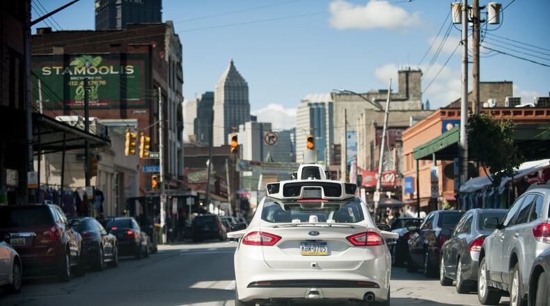 An Uber car drives through Pittsburgh in 2016 to map out the roads and topography before the planned introduction of the company’s driverless vehicles there. Uber’s experiment with autonomous vehicles is proceeding with the blessing of city officials there. The Atlanta Regional Commission visited Pittsburgh this year on its annual LINK trip. (Jeff Swensen/The New York Times)